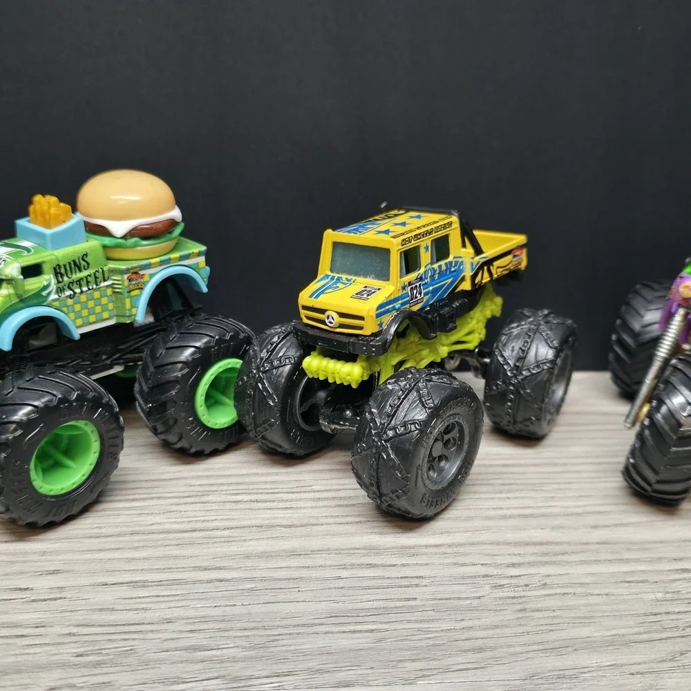 Hotwheels Monster Trucks Lot - Carbonator, Buns Of Steel, Unimog, And Tuk N Roll
